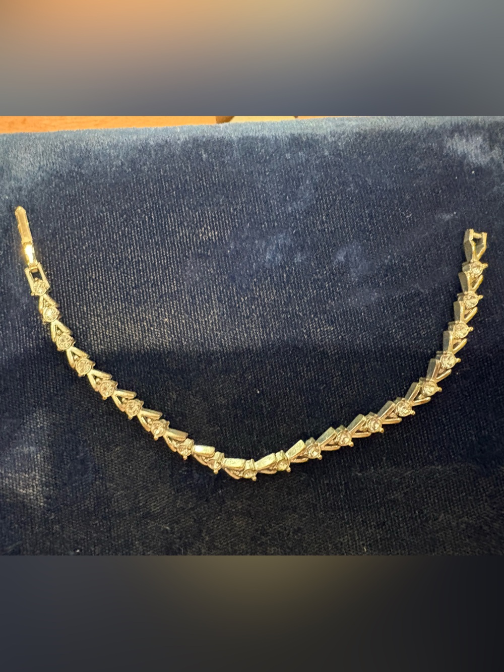 Silver-Tone Heart Link Tennis Bracelet. In pics it looks gold-tone, but is not.